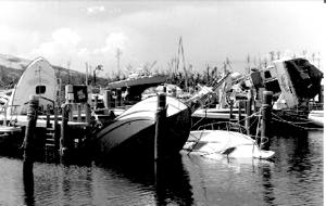 damaged, sunken boats in marina slip
